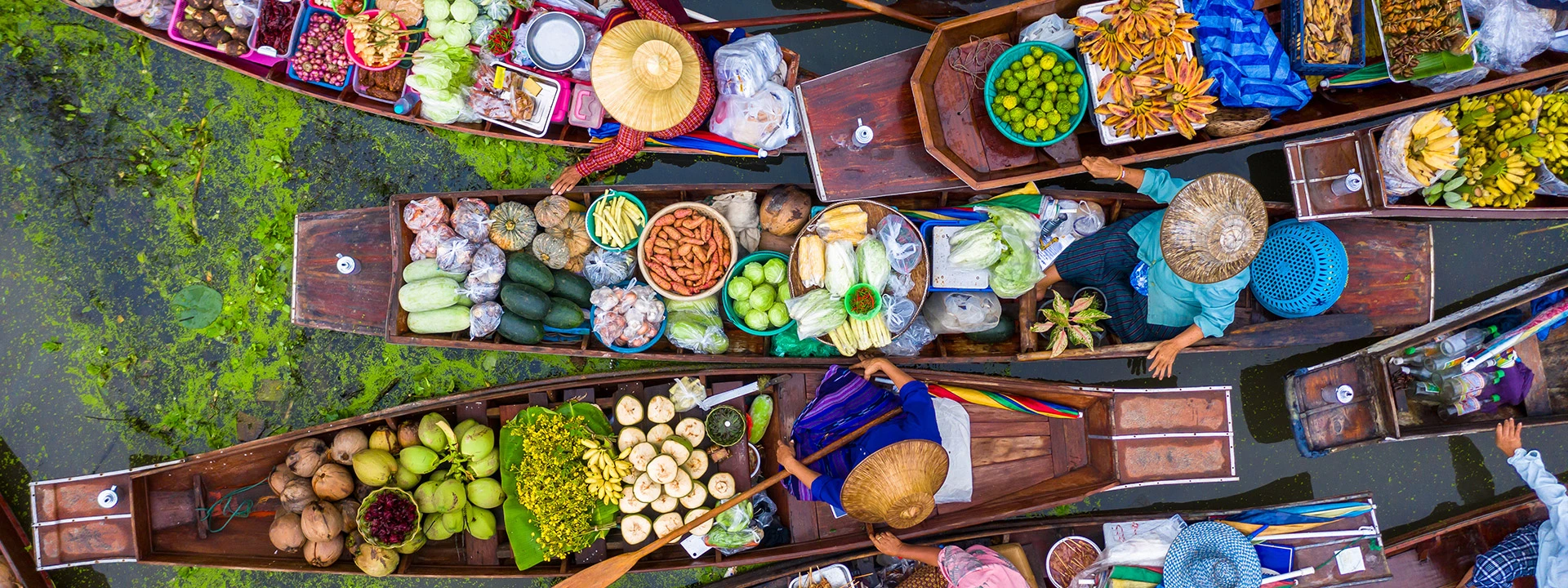 Visit the Damnoen Saduak floating market in Thailand on a Far East Cruise
